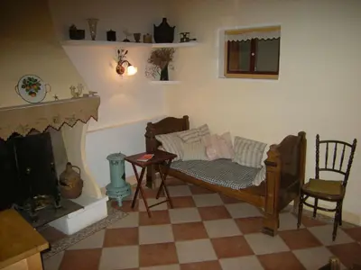 a living room with a couch and a fireplace at 