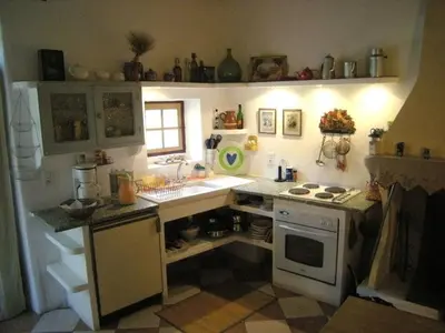a small kitchen with a sink and a stove at 
