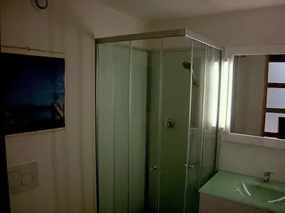 a bathroom with a glass shower and a sink at Maison Marianne Comfortable holiday residence in Ferrals-lès-Corbières