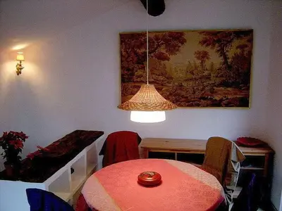 a dining room with a table and a lamp at Maison Marianne Comfortable holiday residence in Ferrals-lès-Corbières