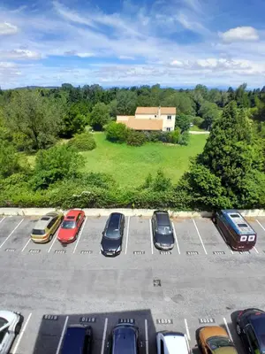 an aerial view of a parking lot with cars parked at Studio Balcon Narbonne Centre in Narbonne