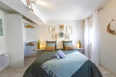 a bedroom with a large bed in a room at Le Canopé - Duplex Confort, Hypercentre, 2 Salles d'eau in Castres