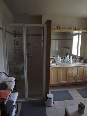 a bathroom with a shower and a sink in a kitchen at Chambres Sainte Anne in Carcassonne
