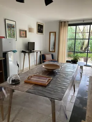 a living room with a table with a bowl on it at Saint laurent de la cabrerisse Rivière proche Lagrasse in Saint-Laurent-de-la-Cabrerisse