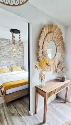 a bedroom with a bed and a mirror and a table at 4-Pieds Cité - Barbacane - Historique - Romantique - Clim in Carcassonne