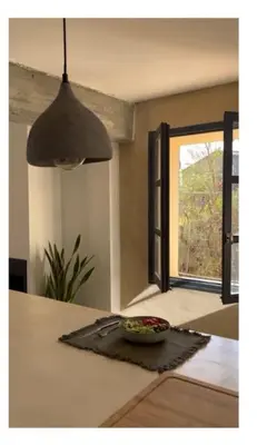 a bowl of food on a counter with a window at Maison Bacchus, gîte insolite dans cuve à vin in Caves