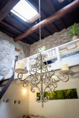 a chandelier hanging from a ceiling in a room at Secluded home in Le Caunil in Salvezines