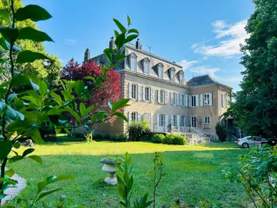 a large house with a yard in front of it at Château Mesdames in Labastide-Rouairoux