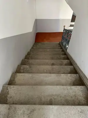 a staircase in a building with a stair case at Thomas Price Appart in Narbonne