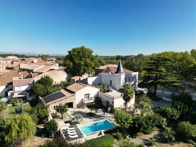 an aerial view of a house with a pool at Château Suite in Saint-Marcel