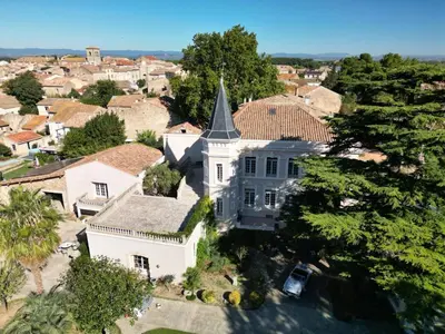 an aerial view of a large white house with a turret at Château Suite in Saint-Marcel