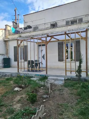 a house under construction with scaffolding on it at Appartement rénové avec jardin in Cuxac-dʼAude