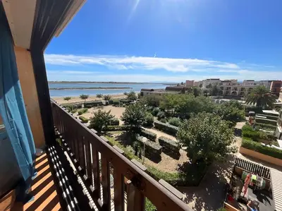 a balcony of a condo with a view of the ocean at Studio vue mer et plage in Gruissan