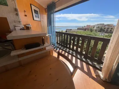 a balcony with a view of the ocean at Studio vue mer et plage in Gruissan