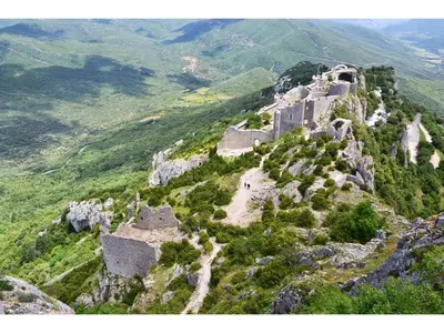 an aerial view of a castle on a mountain at Roulotte in Bugarach