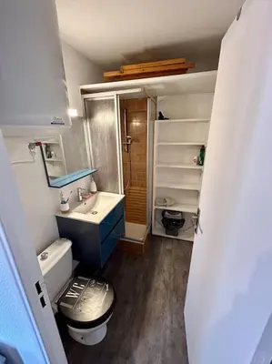 a small bathroom with a toilet and a sink at Superbe Studio avec vue sur le port de Gruissan, piscine, parking in Gruissan