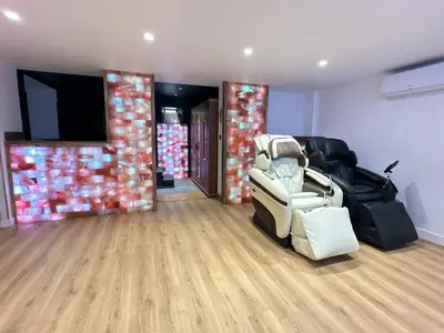 a living room with a couch and a television at Eden de Roques in Castres