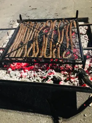 a grill with many different types of food on it at Le Sanglier Noir 14 in Villeneuve-les-Corbières