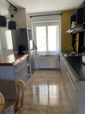 a kitchen with a sink and a counter top at Charmante maison de ville in Mirepoix