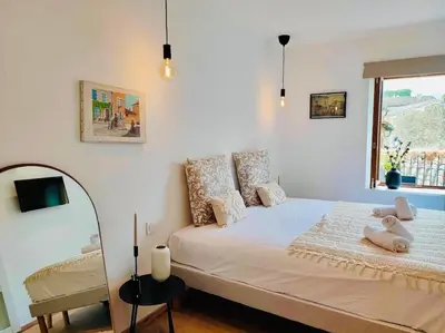 a bedroom with a bed with two stuffed animals on it at Le Rendez Vous - 4 étoiles - parking gratuit in Carcassonne