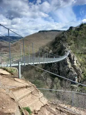 a bridge on top of a mountain at Chambre d'hote la passerelle in Mazamet
