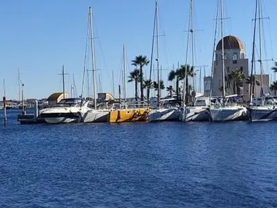 a group of boats docked in a harbor at Gruissan: T3, 4 Pers, Piscine, Parking, Proche Commerce, Environnement Calme, Accès Plage - FR-1-796-14 in Gruissan