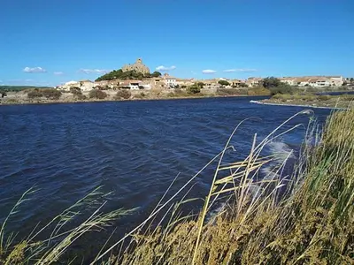a large body of water with buildings in the background at Gruissan - À 2 Pas de la Plage - Studio Cabine pour 4 - Parking Sécurisé - FR-1-796-15 in Gruissan