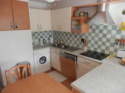 a kitchen with a sink and a washing machine at T2 RDC avec Terrasse, Piscine & Parking - Proche Vieux Village de Gruissan - FR-1-796-20 in Gruissan