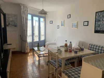 a living room with a white couch and a table at T2 Confort Centre Port 4 Pers - Clim - Parking - Ascenseur - FR-1-796-25 in Gruissan