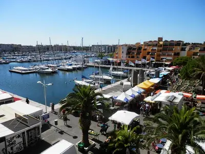 a marina with boats in the water and buildings at T2 Confort Centre Port 4 Pers - Clim - Parking - Ascenseur - FR-1-796-25 in Gruissan
