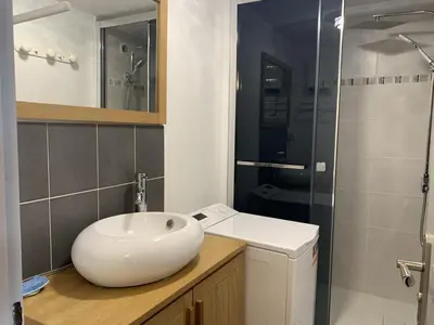a bathroom with a sink and a shower at Gruissan - T2 Mezzanine Climatisé Proche Plage - 5/6 Pers - Parking Privé - Tout Équipé - FR-1-796-23 in Gruissan