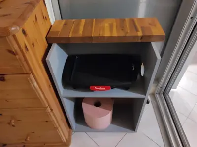 a small desk with a trash can under it at Studio spacieux à Gruissan - Parking - Vue port - Proche plage - FR-1-796-29 in Gruissan