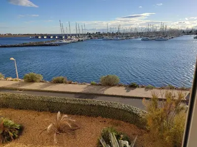 a view of a marina with boats in the water at Gruissan: T2 Spacieux 4/5 Pers, Proche Plage Grazel, Parking Privé - FR-1-796-34 in Gruissan