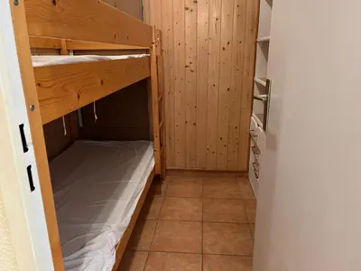 a small room with two bunk beds in it at Studio Familial Piscine, Parking, Proche Plage - Idéal 4 pers, Budget Serré, Gruissan - FR-1-796-58 in Gruissan