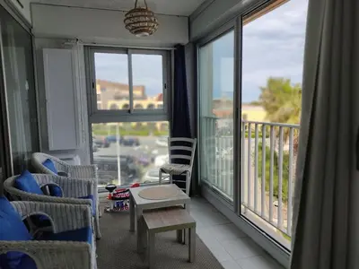 a living room with a view of a balcony at Gruissan Studio Vue Mer 2/3 Pers à 50m Plage Grazel, Parking Sécurisé - FR-1-796-47 in Gruissan