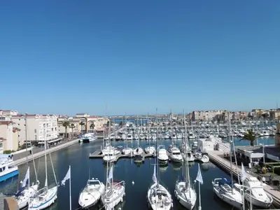 a group of boats docked in a harbor at Gruissan - Appartement climatisé - 6 pers - Parking - Plage à 50m - FR-1-796-51 in Gruissan