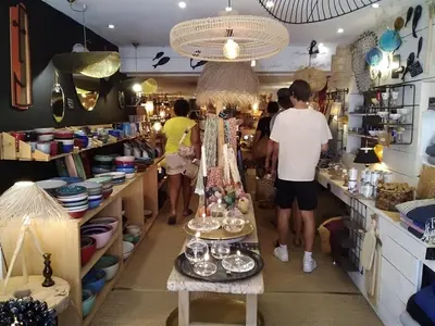 a group of people standing in a store at Appartement T2 moderne avec piscines, garage et proche plage - Gruissan - FR-1-796-43 in Gruissan