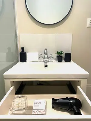 a bathroom with a sink and a mirror at L'Occitane - Grand Studio Chaleureux en Hyper centre in Castres
