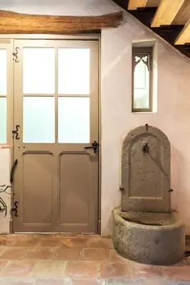 a garage with two doors and a stonefact sidx sidx sidx sidx sidx at Loft centre-ville Parking, clim, wifi in Carcassonne