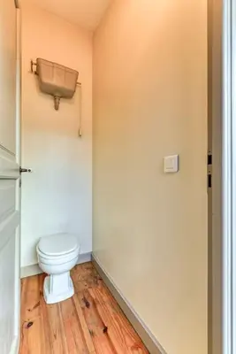 a bathroom with a white toilet in a room at Loft centre-ville Parking, clim, wifi in Carcassonne