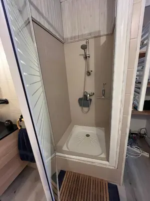 a shower in a small bathroom with a toilet at Maison de village in Peyriac-Minervois