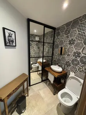 a bathroom with a toilet and a sink at La Vade in Carcassonne