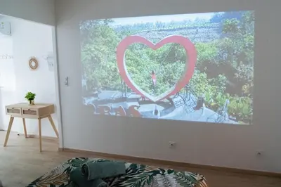 a painting of a heart on a wall in a room at Tout confort ! Balnéo, Sauna, Cinéma, Climatisation, Parking, WiFi in Carcassonne