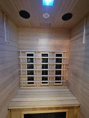 a sauna with two windows in the middle at Tout confort ! Balnéo, Sauna, Cinéma, Climatisation, Parking, WiFi in Carcassonne