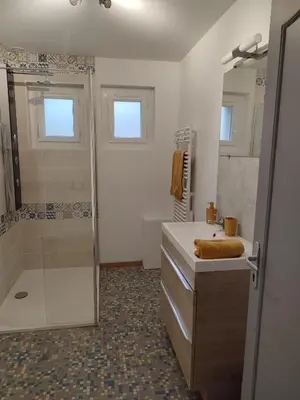 a bathroom with a shower and a sink at Au coeur de l'occitanie in Cuq