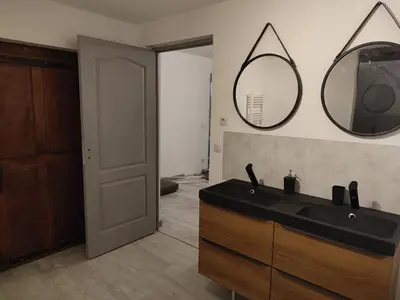 a bathroom with a black sink and a mirror at Au coeur de l'occitanie in Cuq