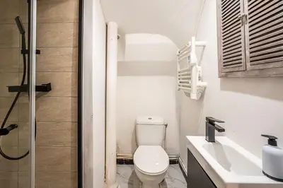 a bathroom with a toilet and a sink and a shower at Escape Game & Room - Cathédrale - Grands Buffets - Narbonne in Narbonne