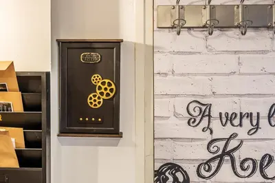 a door with a sign on it next to boxes at Escape Game & Room - Cathédrale - Grands Buffets - Narbonne in Narbonne