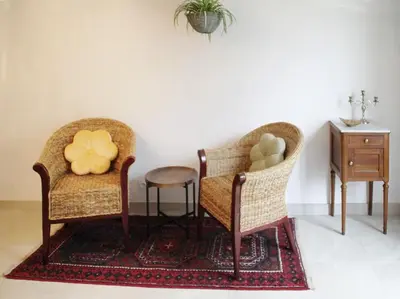 a living room with two chairs and a table at La Maison de Berthe - Havre de paix dans la campagne - Entièrement rénovée et équipéé in Montmaur