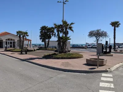 a gas station on the corner of a street at Charmante villa T2 mezzanine avec cour, jardin, véranda, barbecue et parking privé, proche plage et commerces - FR-1-797-2 in Port-la-Nouvelle